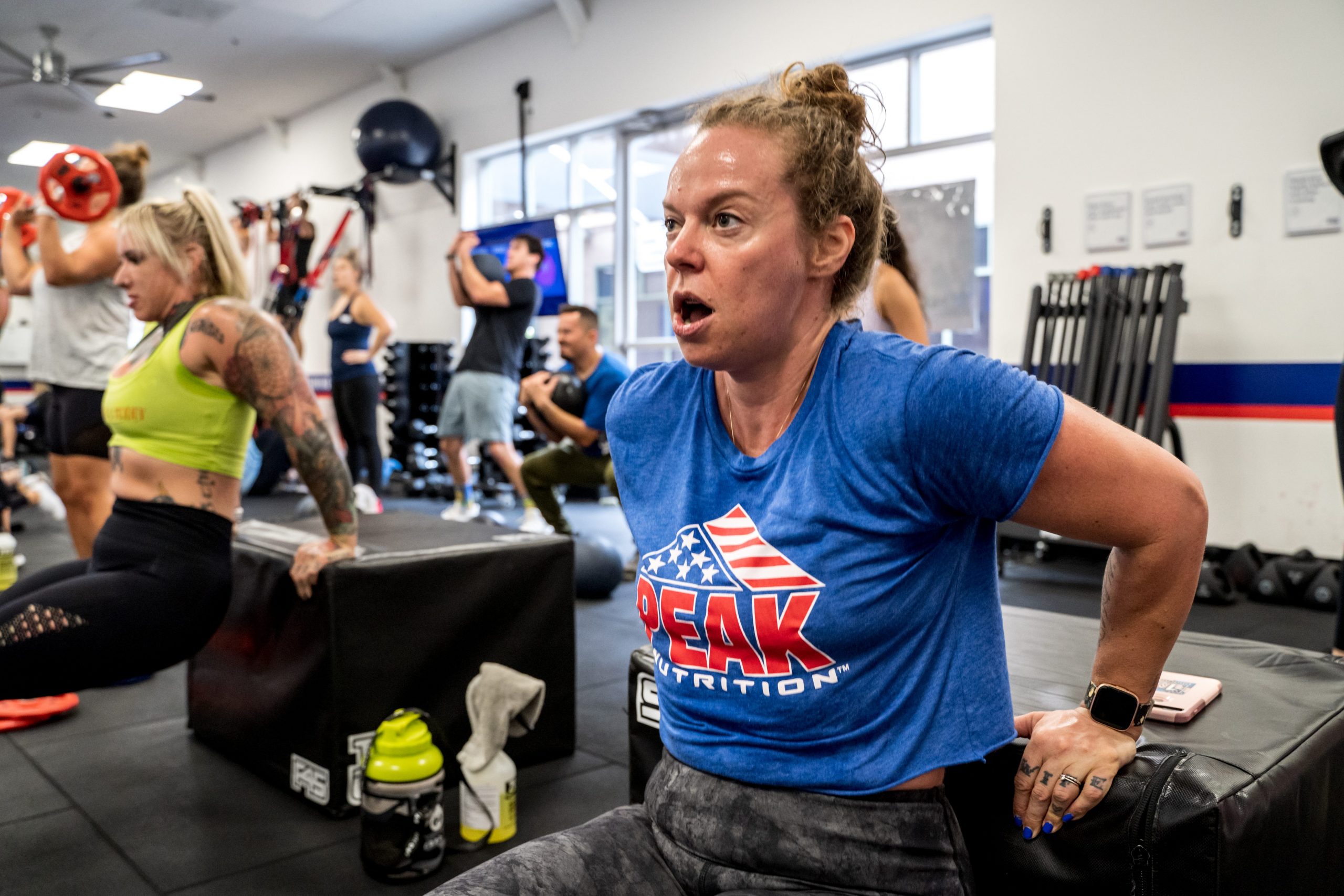 woman working out in blue shirt
